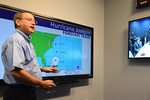 A forecaster with the National Hurricane Center in Miami briefs FEMA about the track forecast for Hurricane Joaquin in 2015